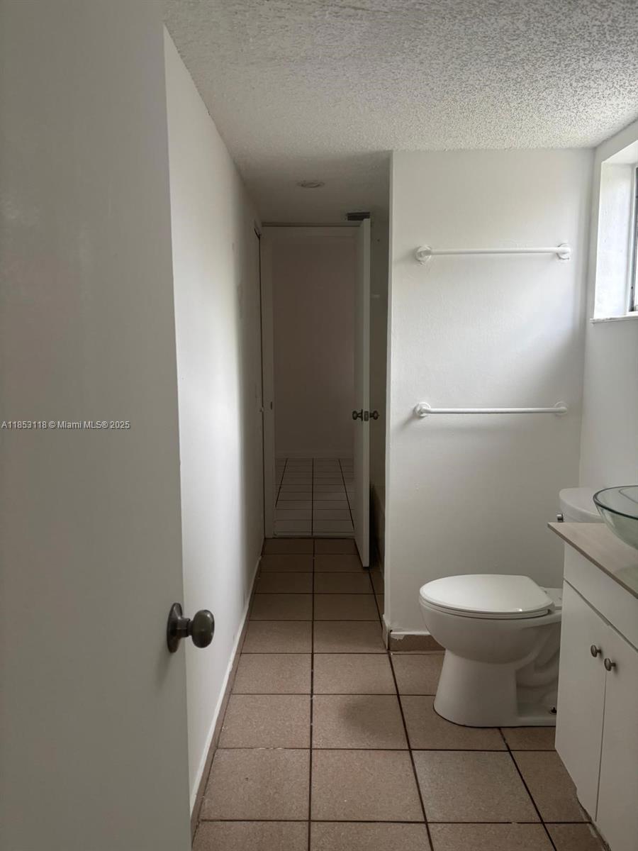 2710 West 76th Street, Unit 101 Hialeah, FL 33016 - Photo 8 of 14 a bathroom with a toilet and a shower