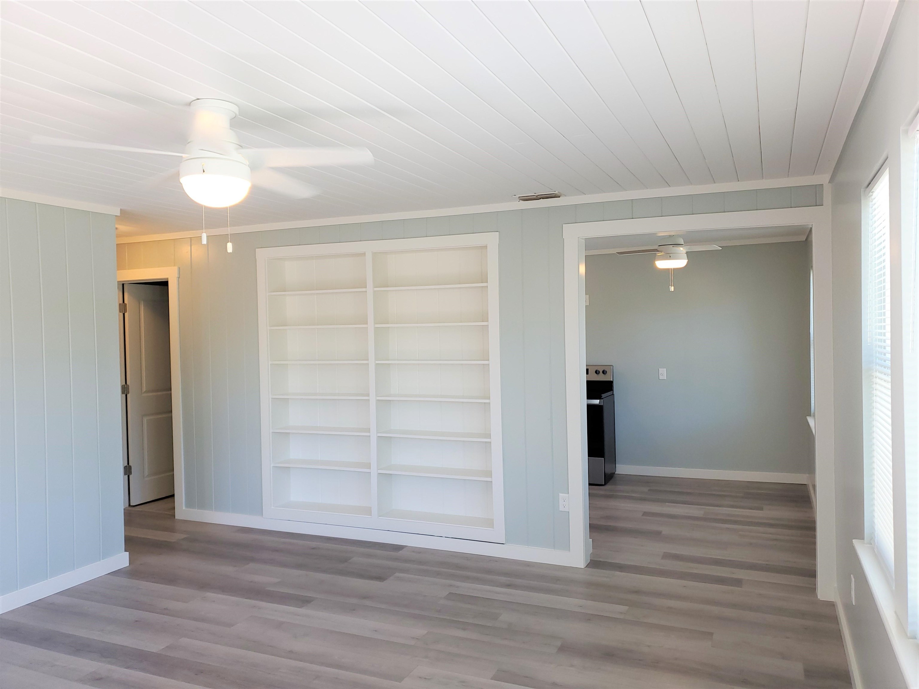 105 Beachcomber Way St. Augustine, FL 32084 - Photo 19 of 23 wooden floor in an empty room with a mirror