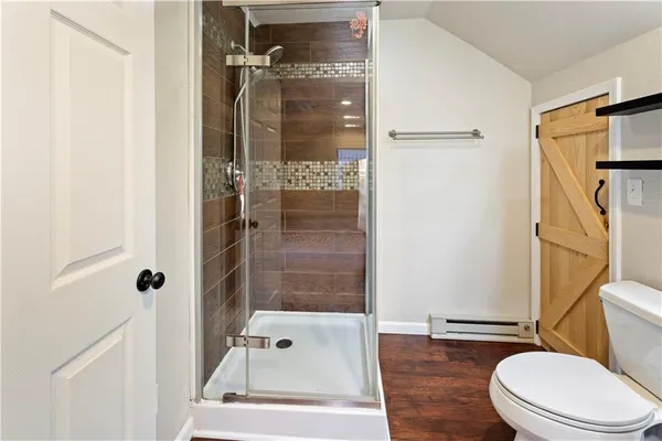 a toilet sitting next to a bathroom