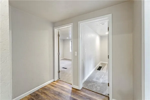 a view of a bathroom from a hallway