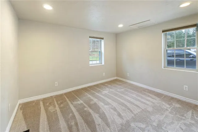 an empty room with windows