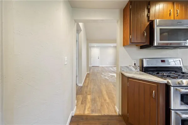 a kitchen with a stove and a microwave