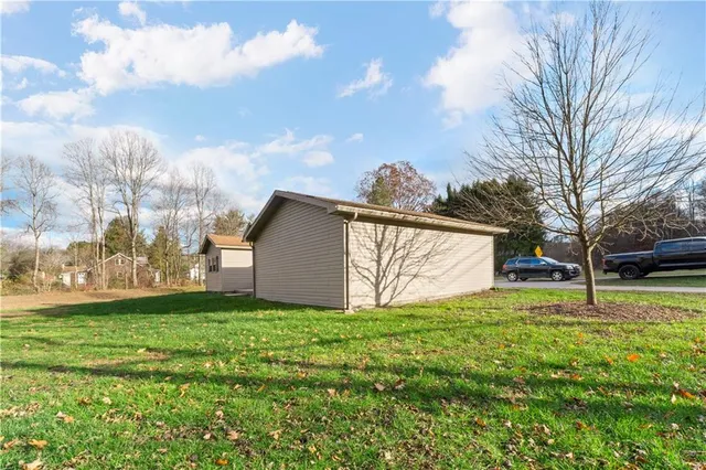 a view of a backyard with large trees