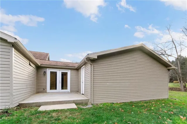 a view of house with a yard