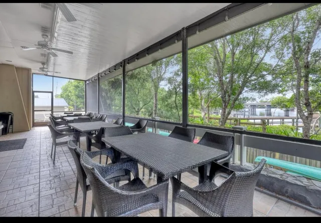 a view of a dining room with furniture window and outside view