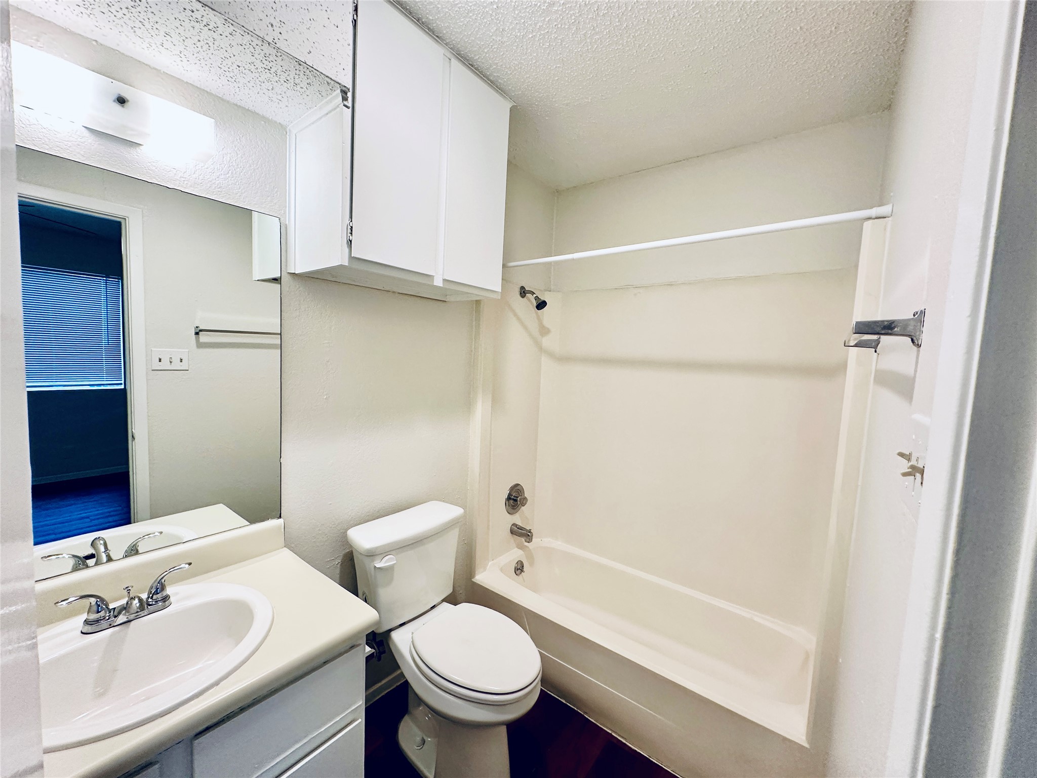 12505 Turtle Rock Road, Unit A Austin, TX 78729 - Photo 17 of 38 A compact bathroom offers essential amenities for daily routines.
