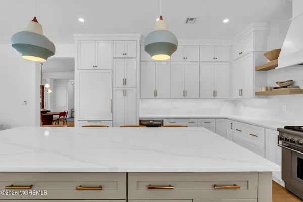 a bathroom with a shower and a sink