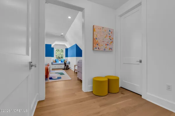 a bedroom with a bed a table and chair