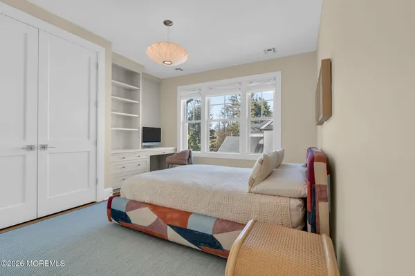 a view of backyard with furniture and trees