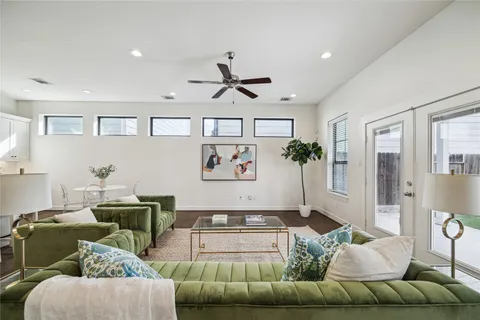 a living room with furniture and kitchen view