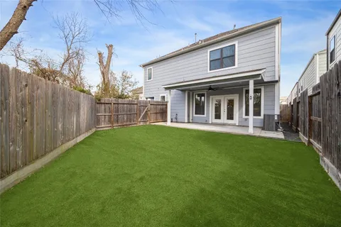 a view of a house with a backyard and a garden