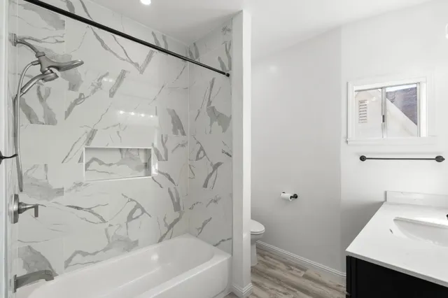 a bathroom with a bathtub and a sink