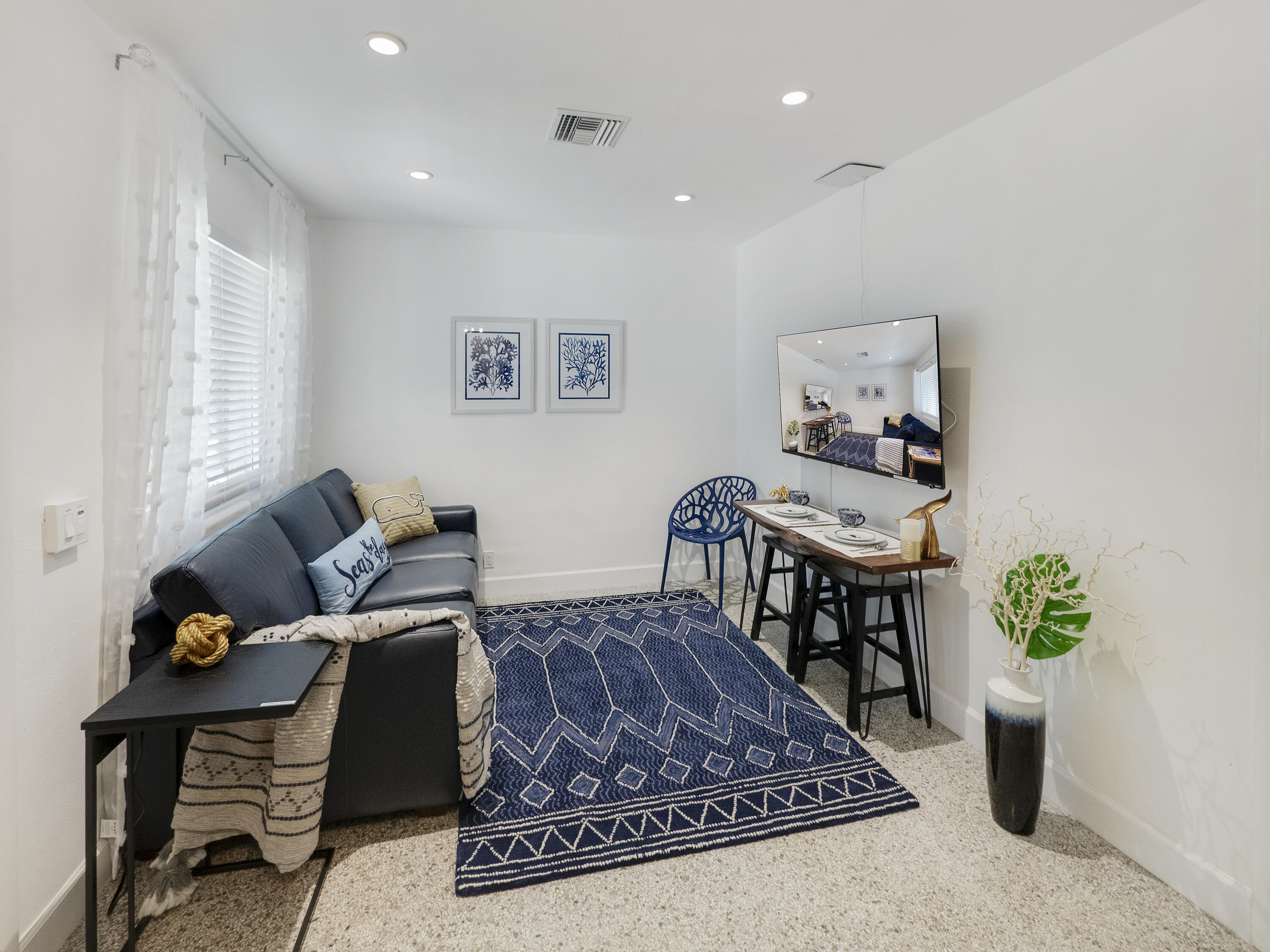 1258 Beach Road, Unit 8 Singer Island, FL 33404 - Photo 7 of 11 a living room with furniture
