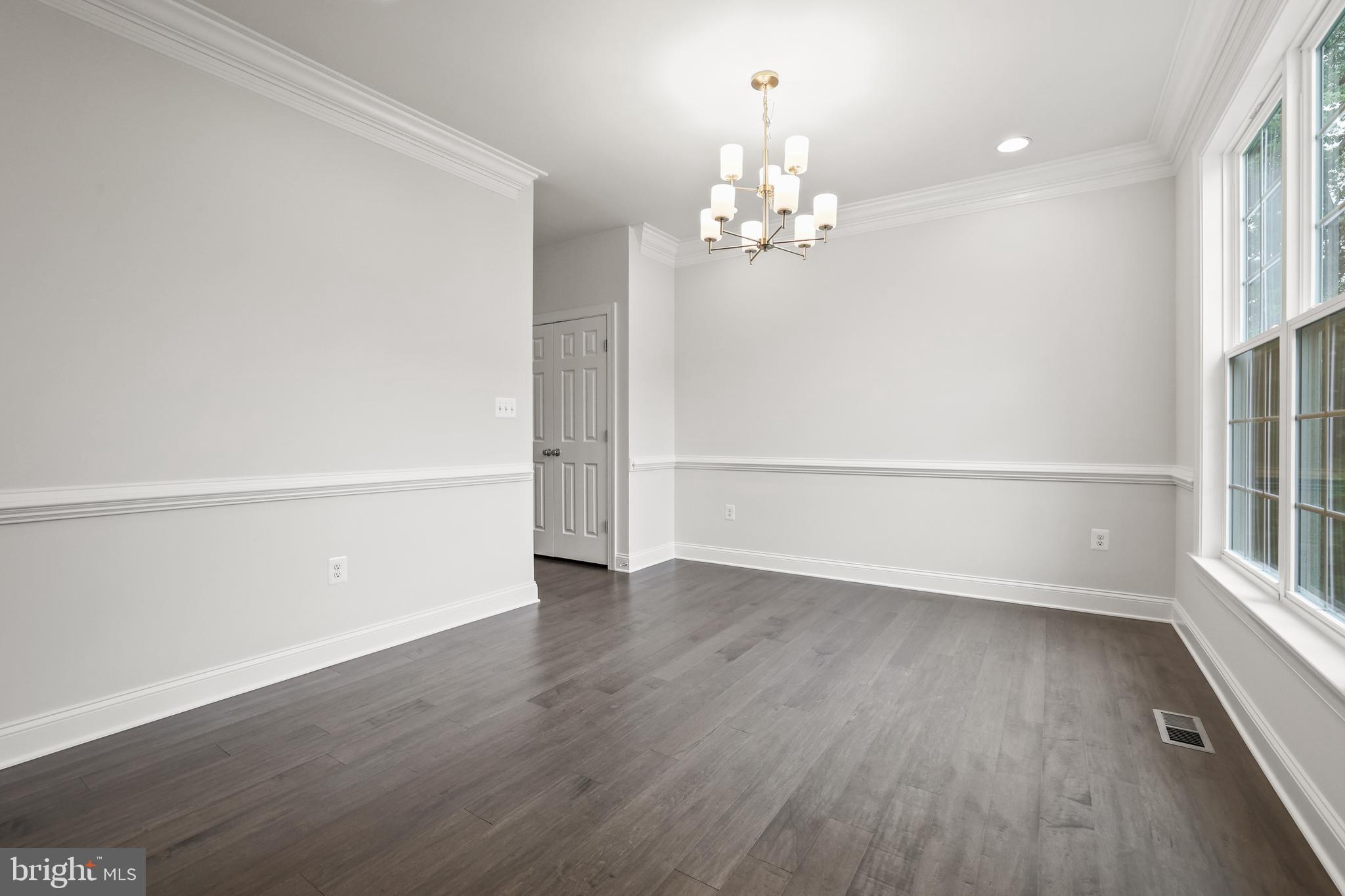 14496 Aurora Drive Woodbridge, VA 22193 - Photo 11 of 70 wooden floor in an empty room with a window