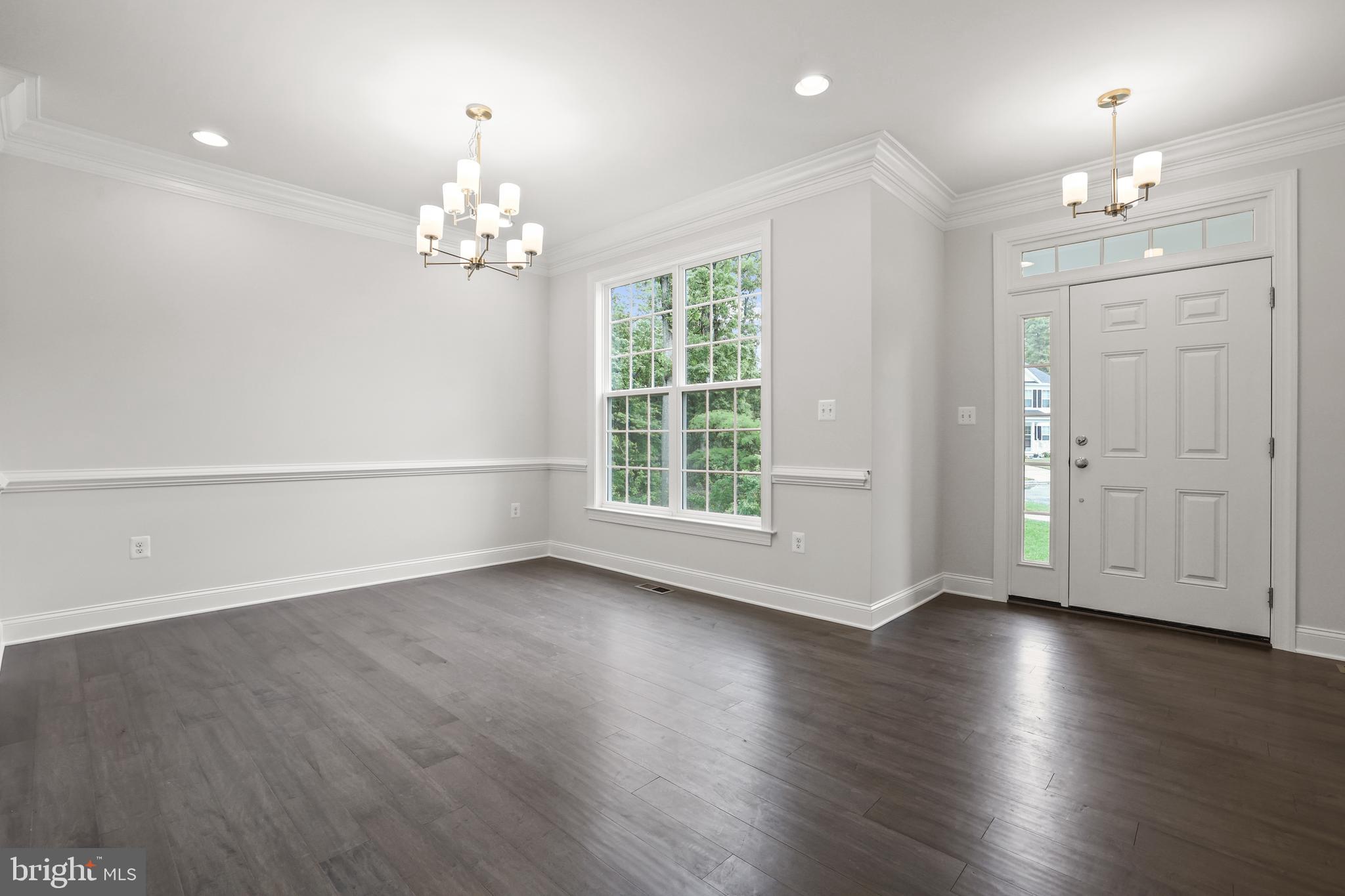 14496 Aurora Drive Woodbridge, VA 22193 - Photo 12 of 70 a view of an empty room with wooden floor and a window