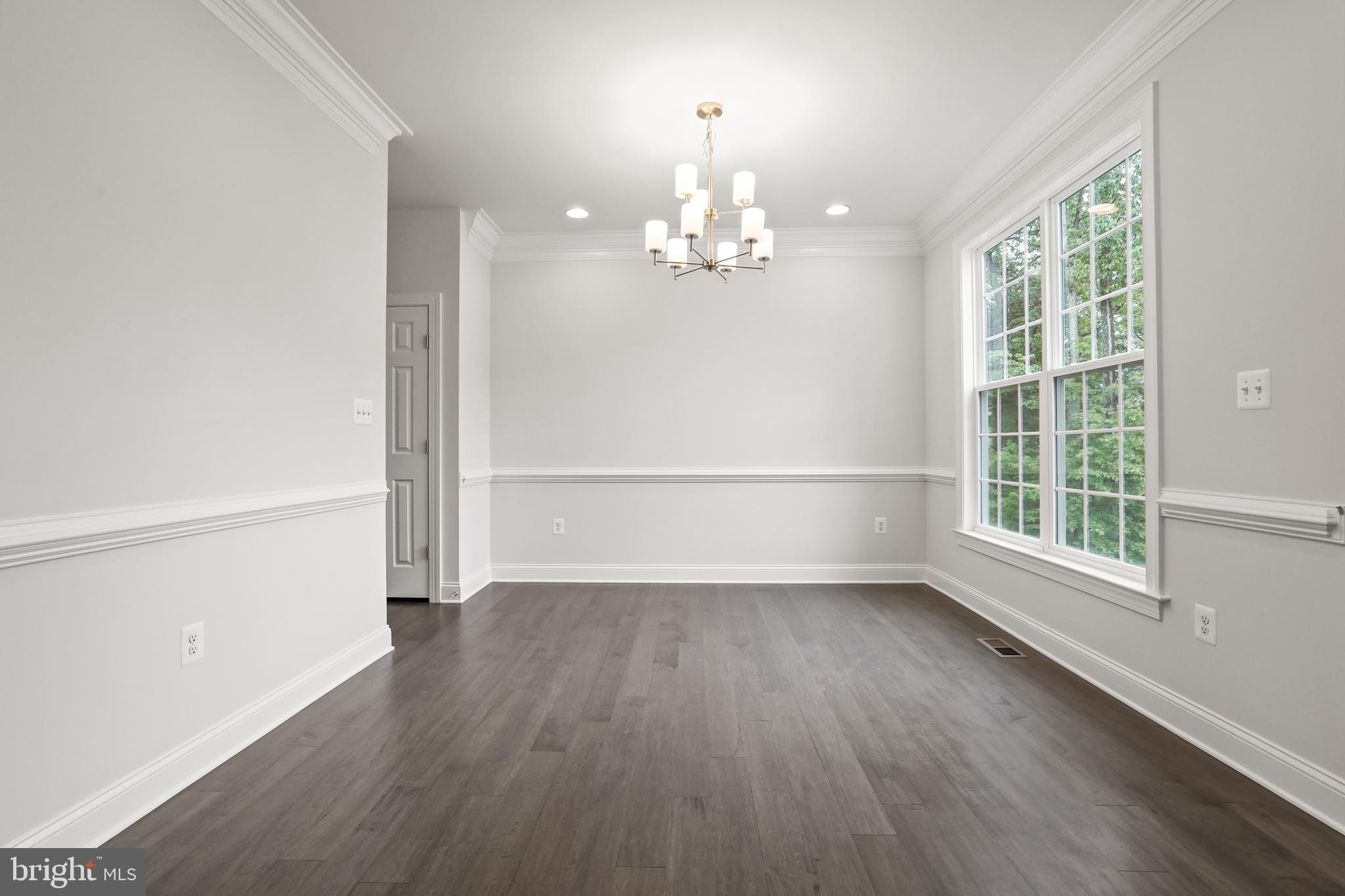 14496 Aurora Drive Woodbridge, VA 22193 - Photo 13 of 70 wooden floor in an empty room with a window
