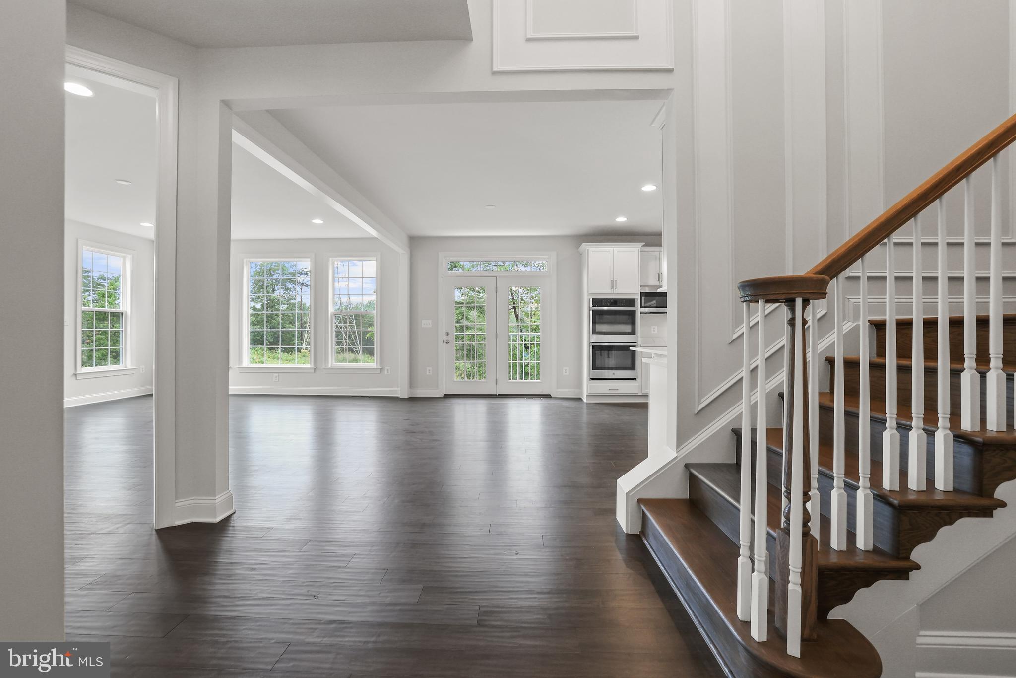 14496 Aurora Drive Woodbridge, VA 22193 - Photo 16 of 70 a view of livingroom with furniture staircase and windows