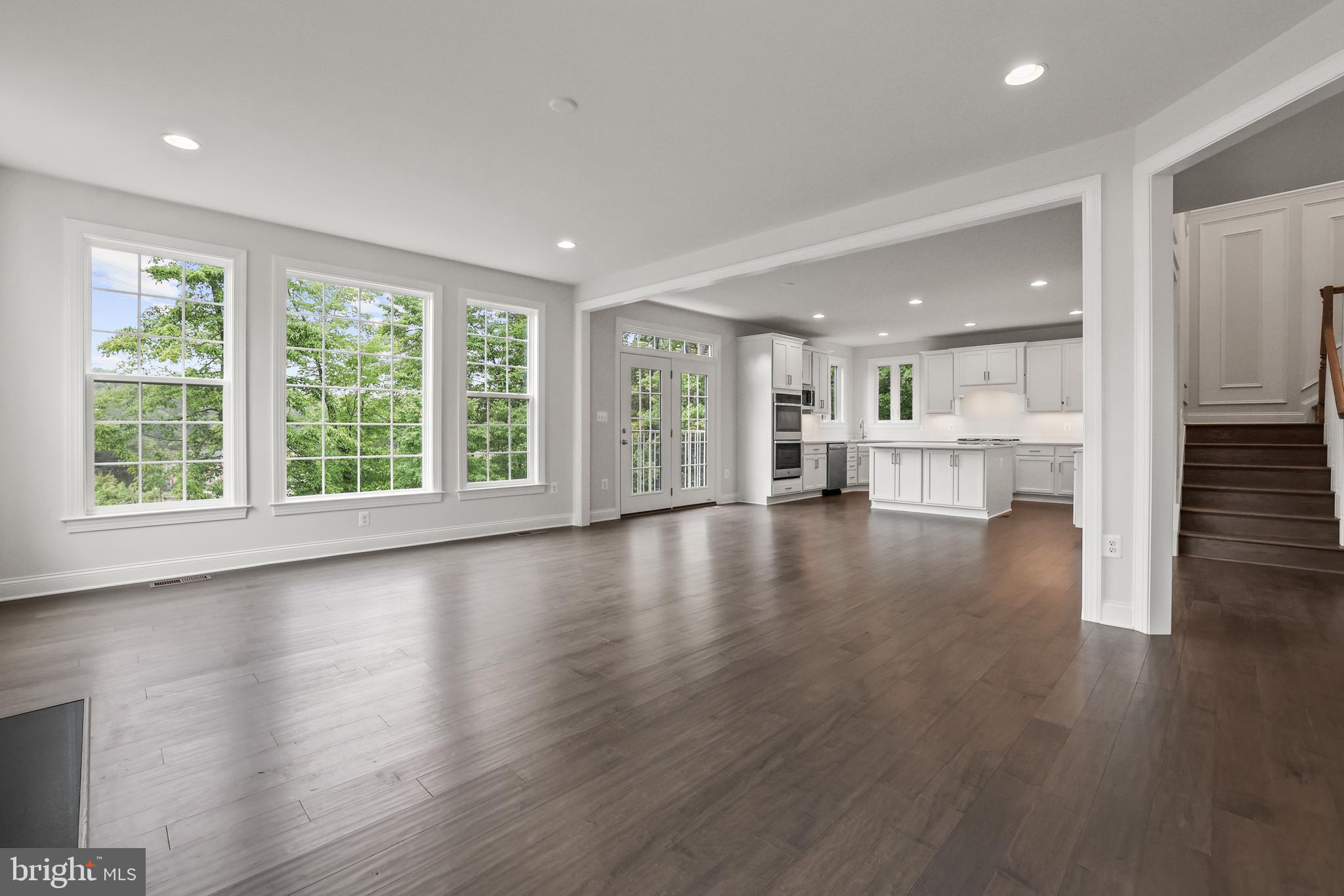 14496 Aurora Drive Woodbridge, VA 22193 - Photo 19 of 70 an empty room with wooden floor and windows
