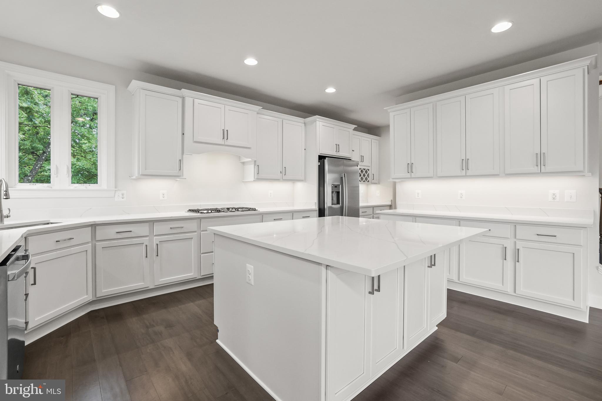 14496 Aurora Drive Woodbridge, VA 22193 - Photo 25 of 70 a kitchen with granite countertop white cabinets and white appliances
