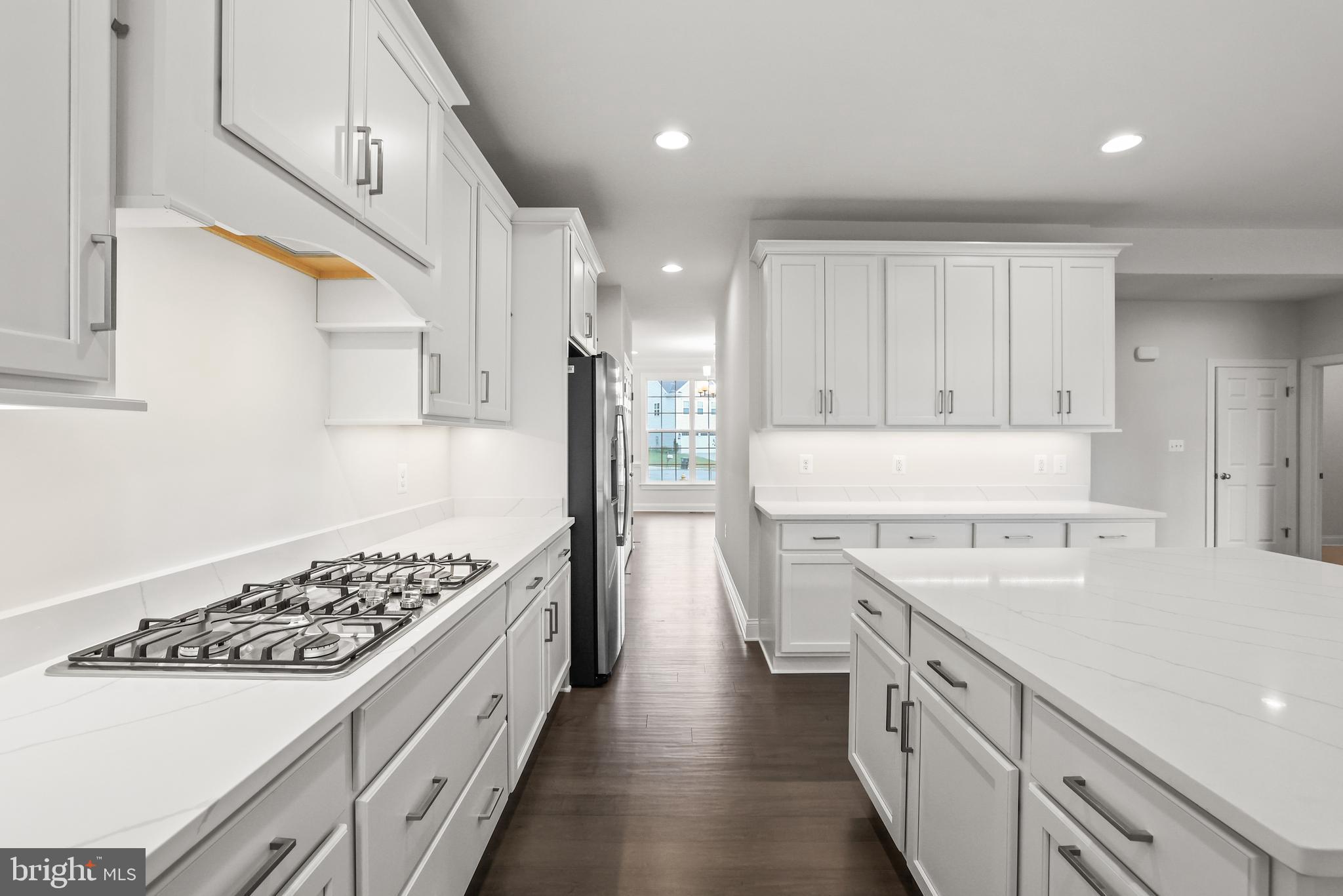 14496 Aurora Drive Woodbridge, VA 22193 - Photo 28 of 70 a kitchen with a sink stove and refrigerator