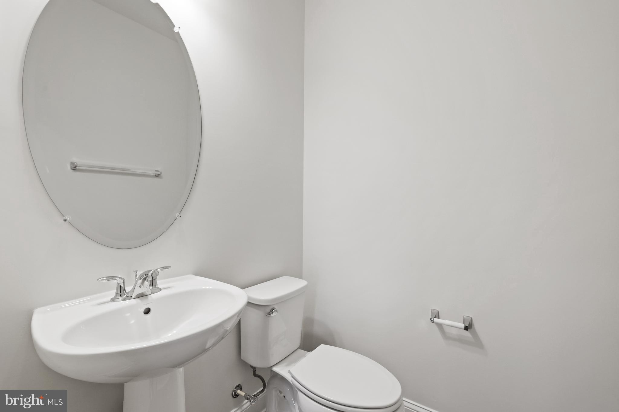 14496 Aurora Drive Woodbridge, VA 22193 - Photo 35 of 70 a bathroom with a sink a mirror and toilet