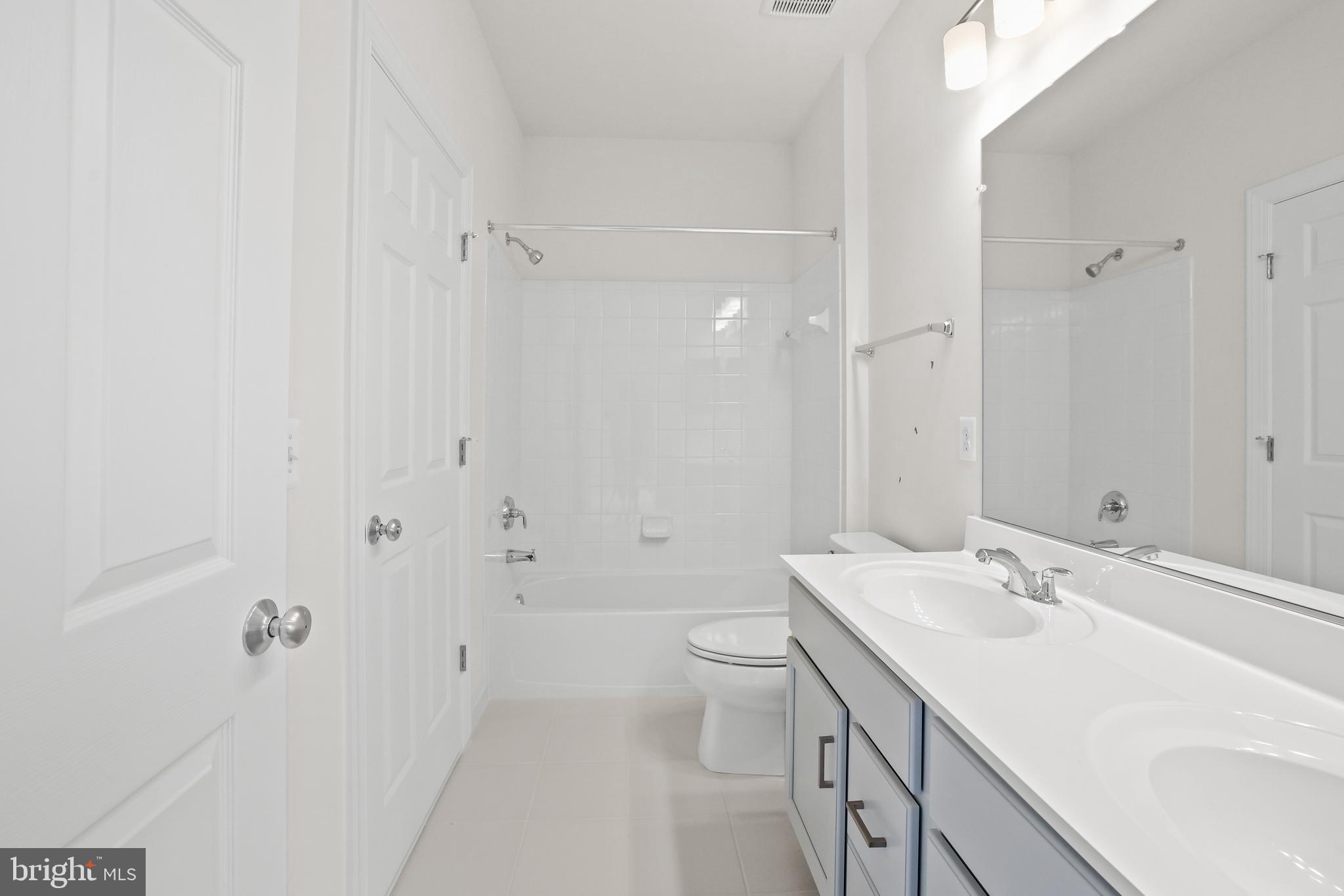 14496 Aurora Drive Woodbridge, VA 22193 - Photo 45 of 70 a bathroom with a sink a toilet and shower