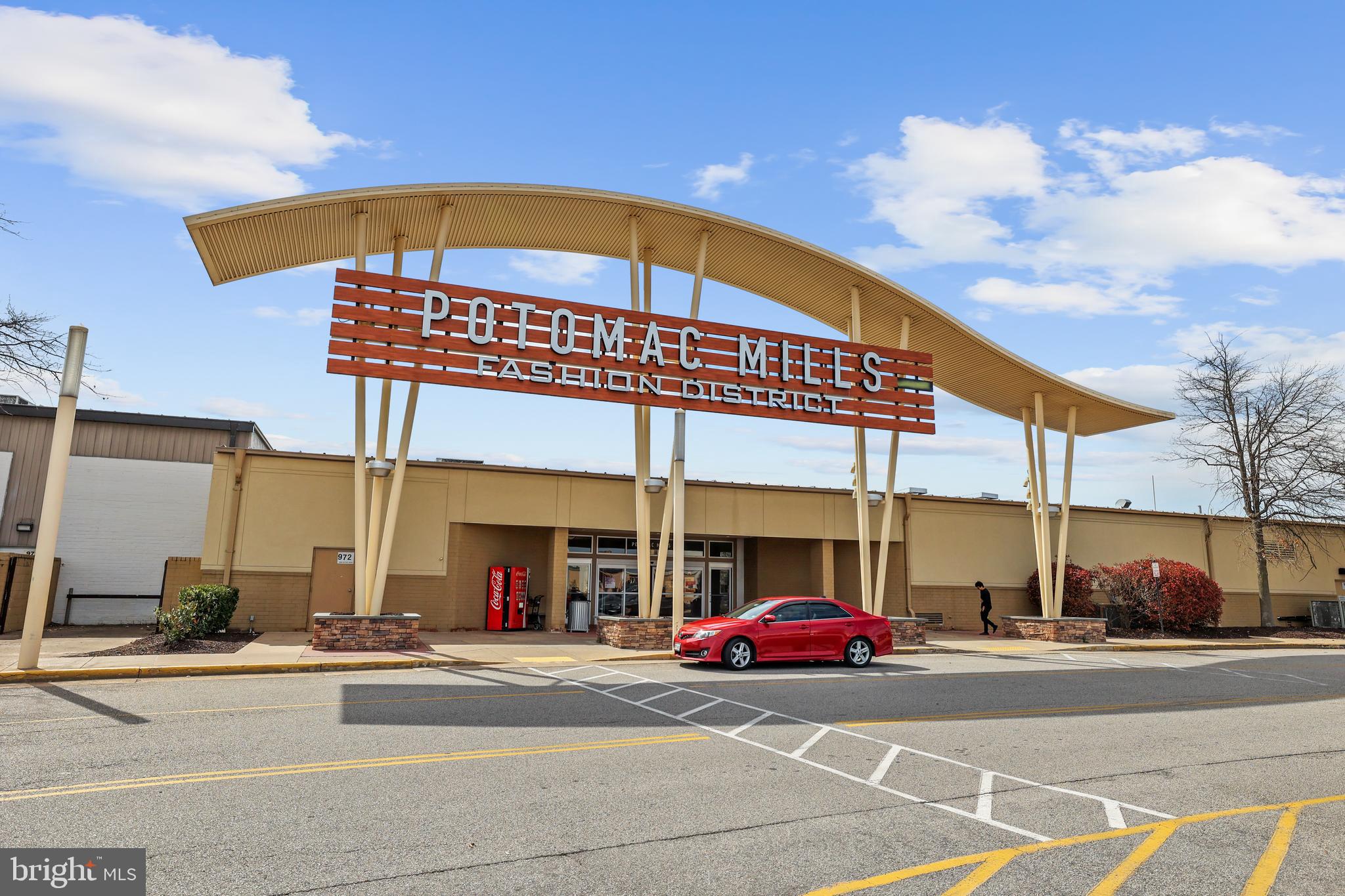 14496 Aurora Drive Woodbridge, VA 22193 - Photo 58 of 70 a view of a food mall with a cars parked in front of it