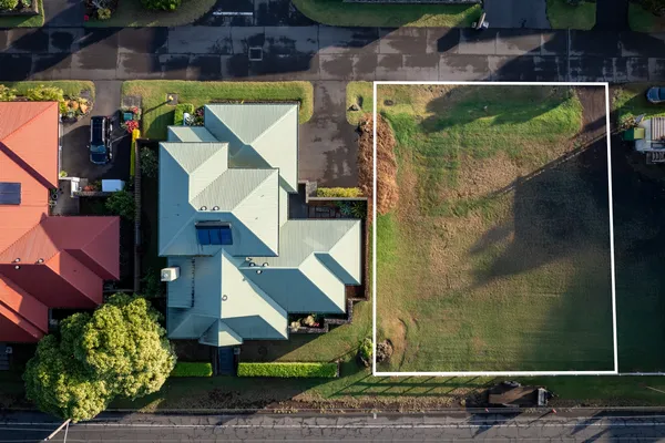 a aerial view of a house with a yard
