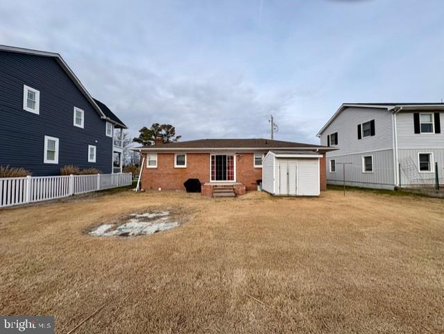 12546 Selsey Road Ocean City, MD 21842 - Photo 3 of 4 a front view of a house with a yard