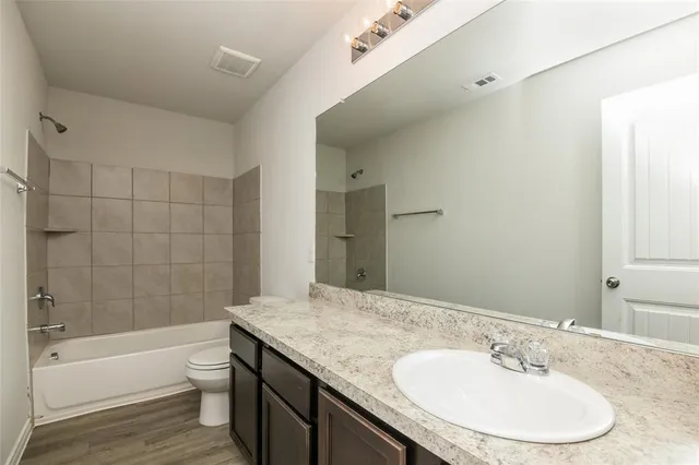 a bathroom with a sink and a toilet