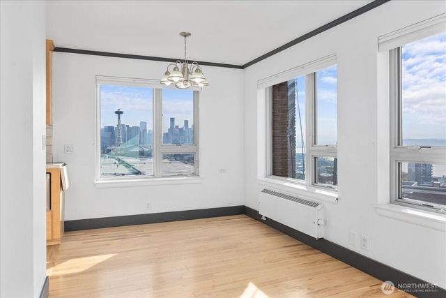 a bathroom with a bathtub and next to a window