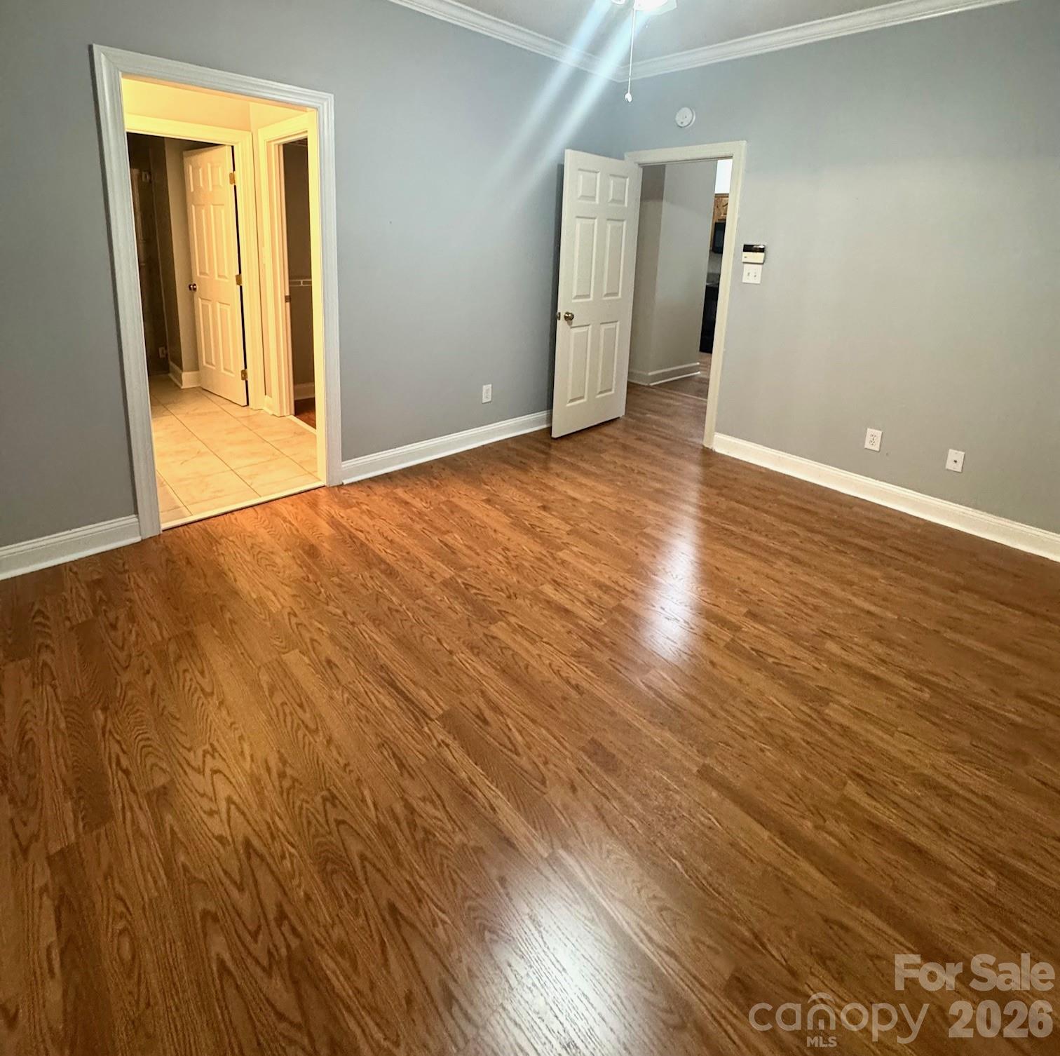 6295 Pansy Trail Denver, NC 28037 - Photo 9 of 27 an empty room with wooden floor and windows