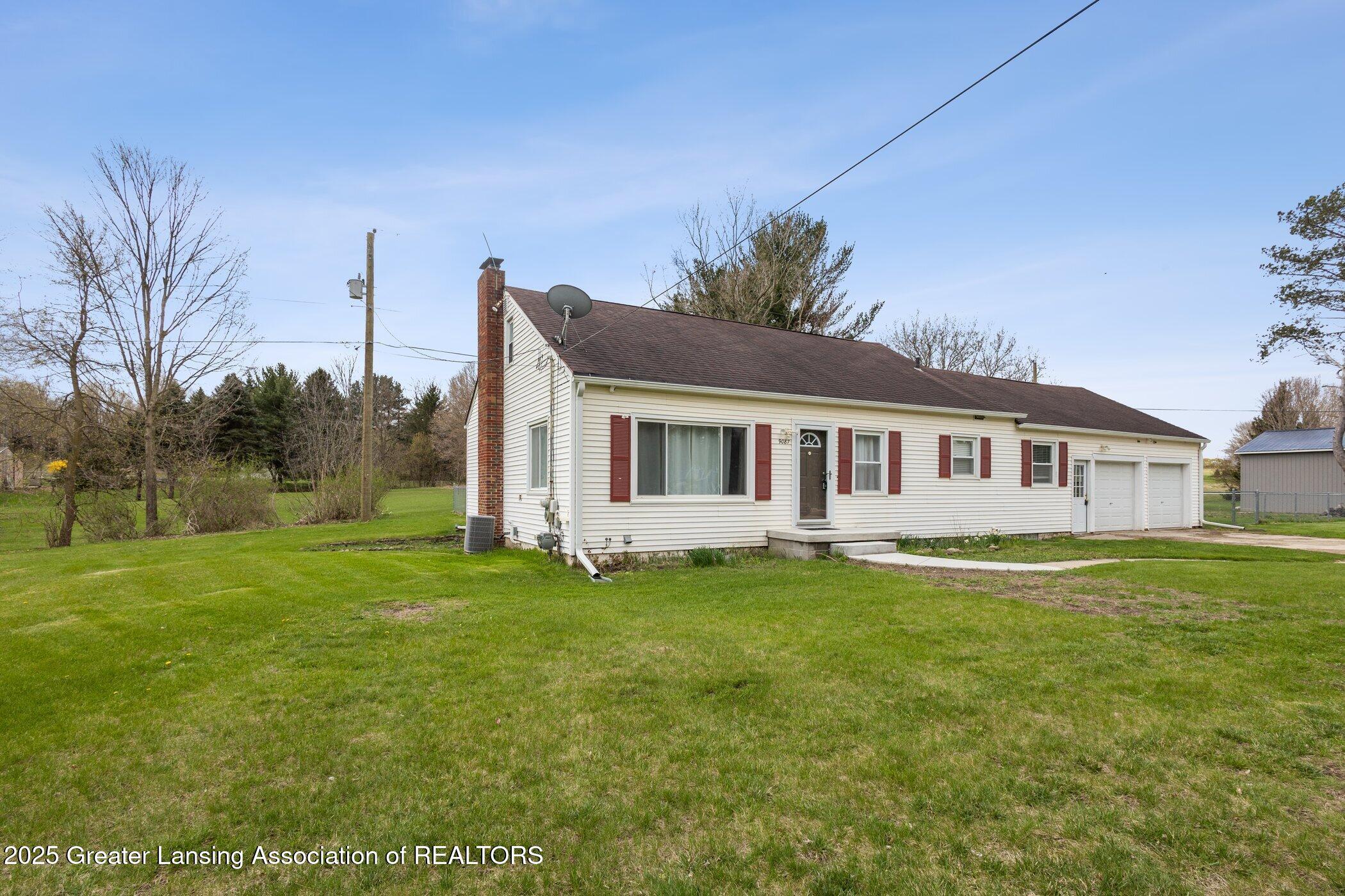 9087 Clark Road Grand Ledge, MI 48837 - Photo 2 of 33 9087-Clark-Rd-side view