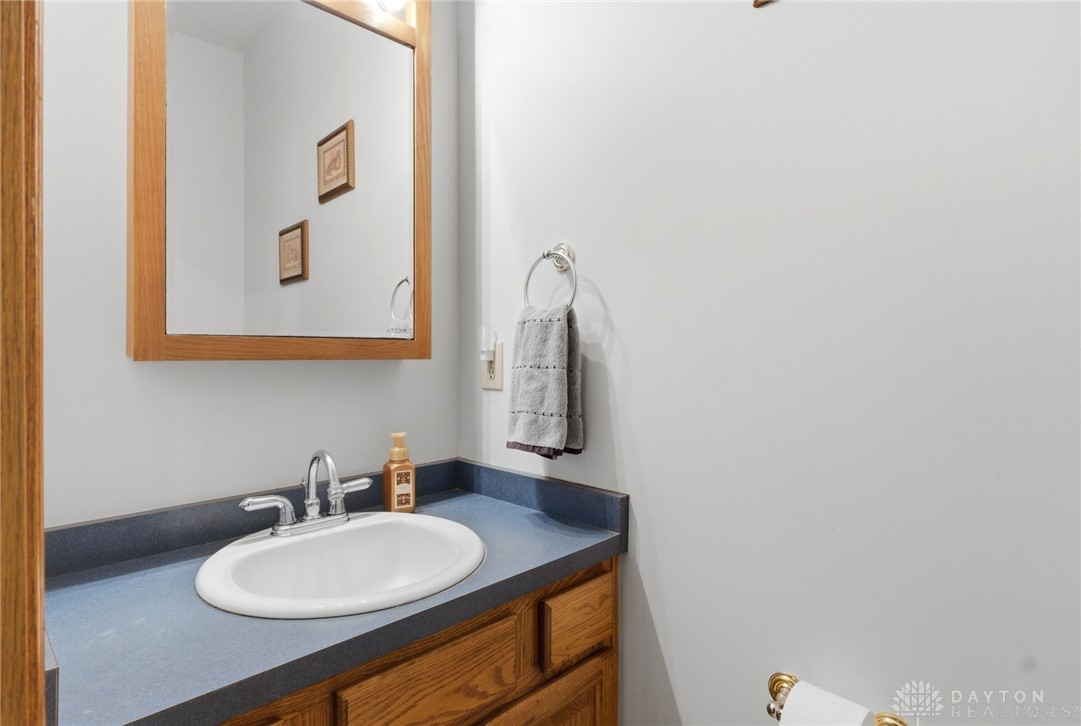 1540 Jasper Road Xenia, OH 45385 - Photo 23 of 91 This functional bathroom features a classic vanity and mirror, ideal for daily routines.