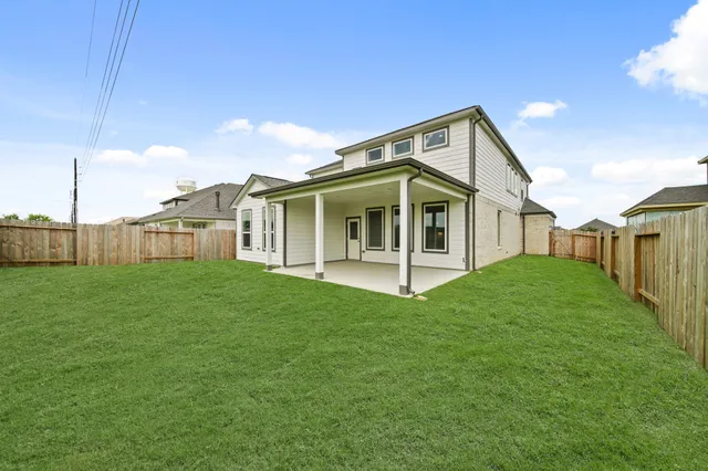 an aerial view of a house with a swimming pool