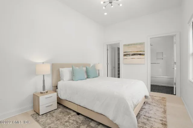 a bedroom with a bed and a cabinets