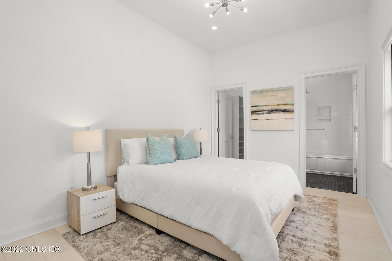 111 Mill Street, Unit PH Greenwich, CT 06830 - Photo 15 of 20 a bedroom with a bed and a cabinets