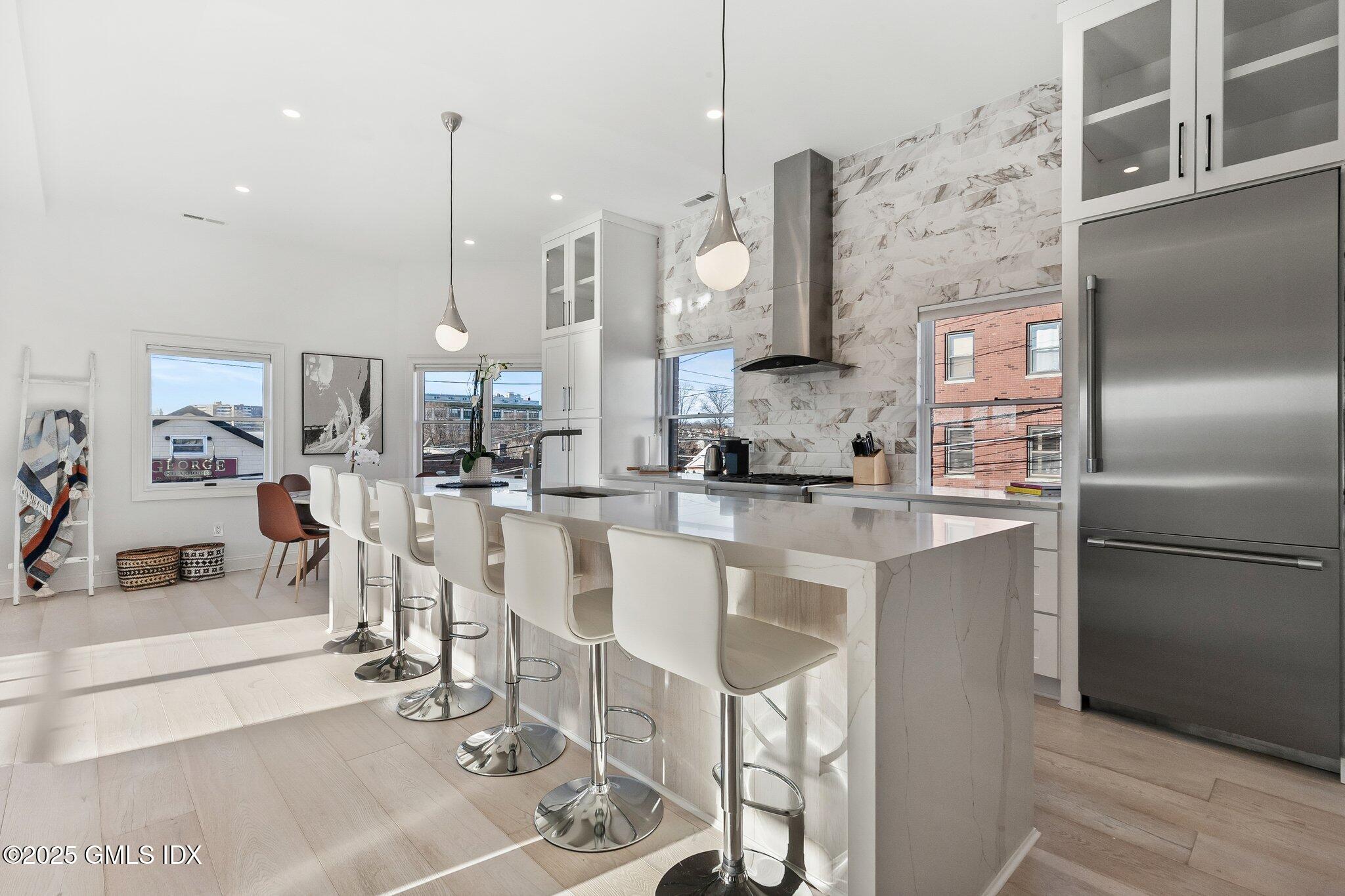 111 Mill Street, Unit PH Greenwich, CT 06830 - Photo 8 of 20 a large kitchen with cabinets