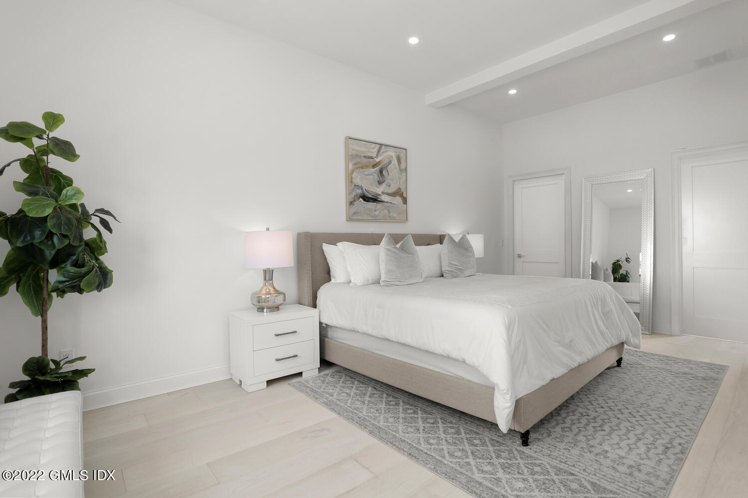 111 Mill Street, Unit PH Greenwich, CT 06830 - Photo 10 of 20 a bedroom with a bed and a potted plant