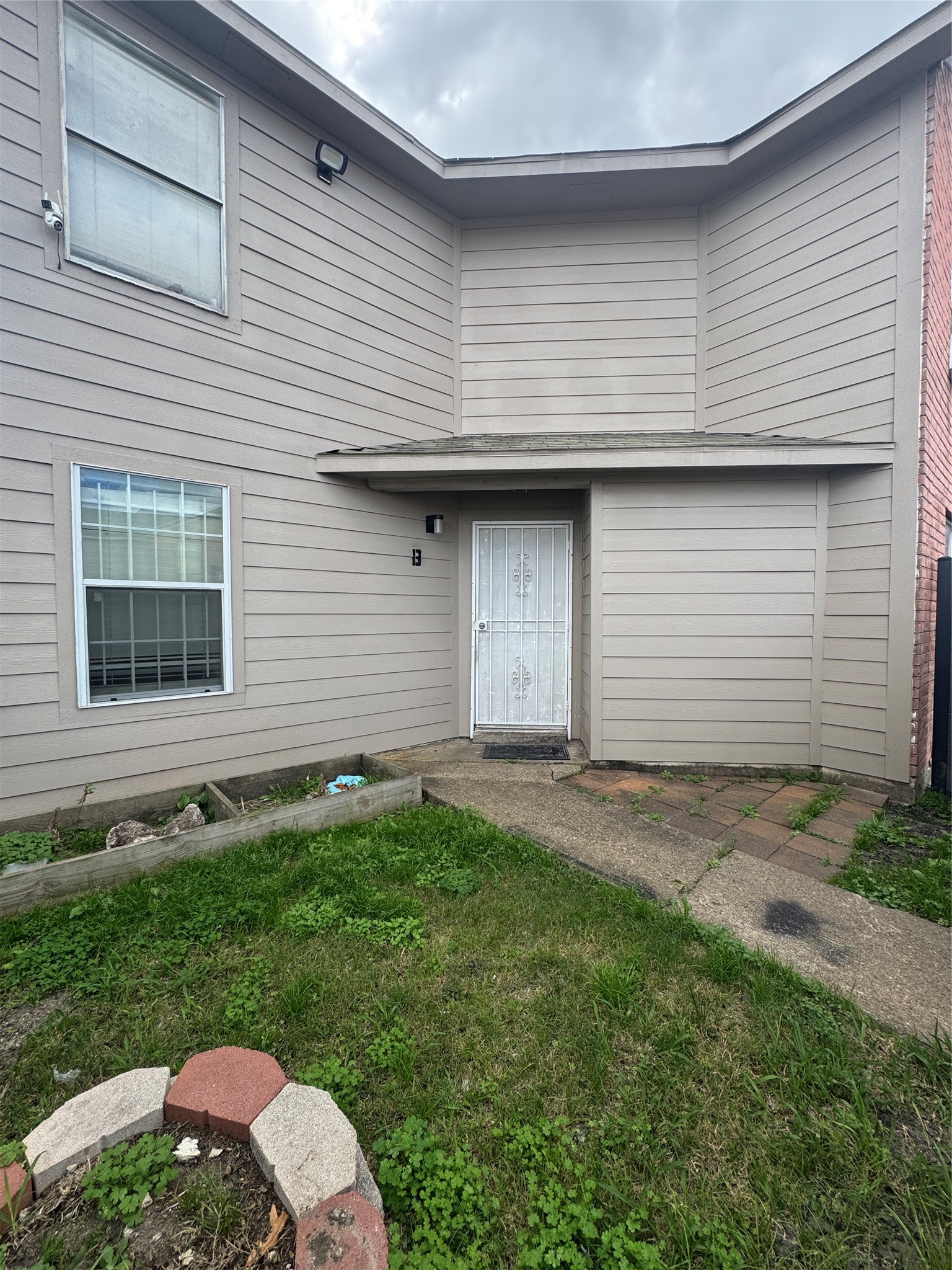 12700 Leader Street, Unit B Houston, TX 77072 - Photo 2 of 7 a front view of a house with a yard