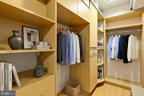 a bedroom with a large bed and a rug