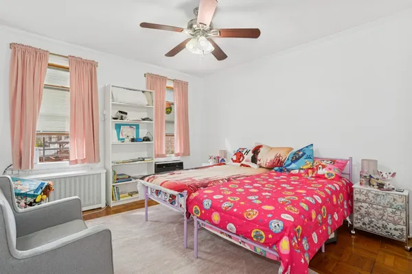 a bedroom with a bed and a couch