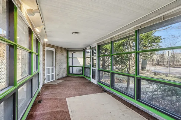 a view of a porch with a large window