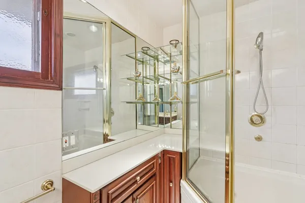 a bathroom with a shower and a sink