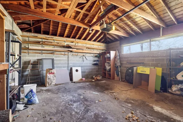 a view of a garage with rack and a garage