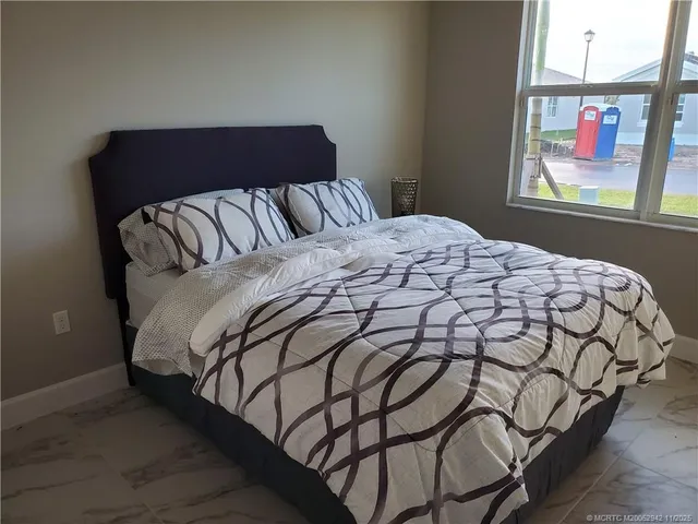 a bedroom with a bed and dresser