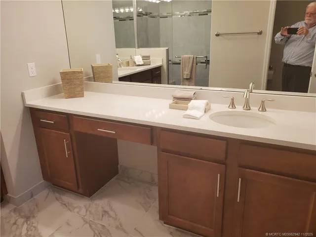 a bathroom with a sink and a mirror