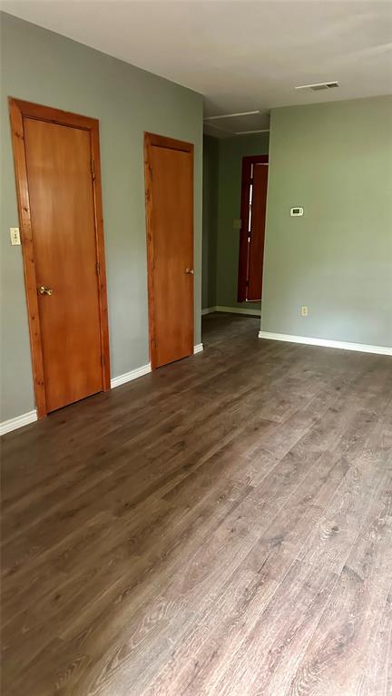 126 Garza Road Shady Shores, TX 76208 - Photo 13 of 19 a view of an empty room with wooden floor and closet