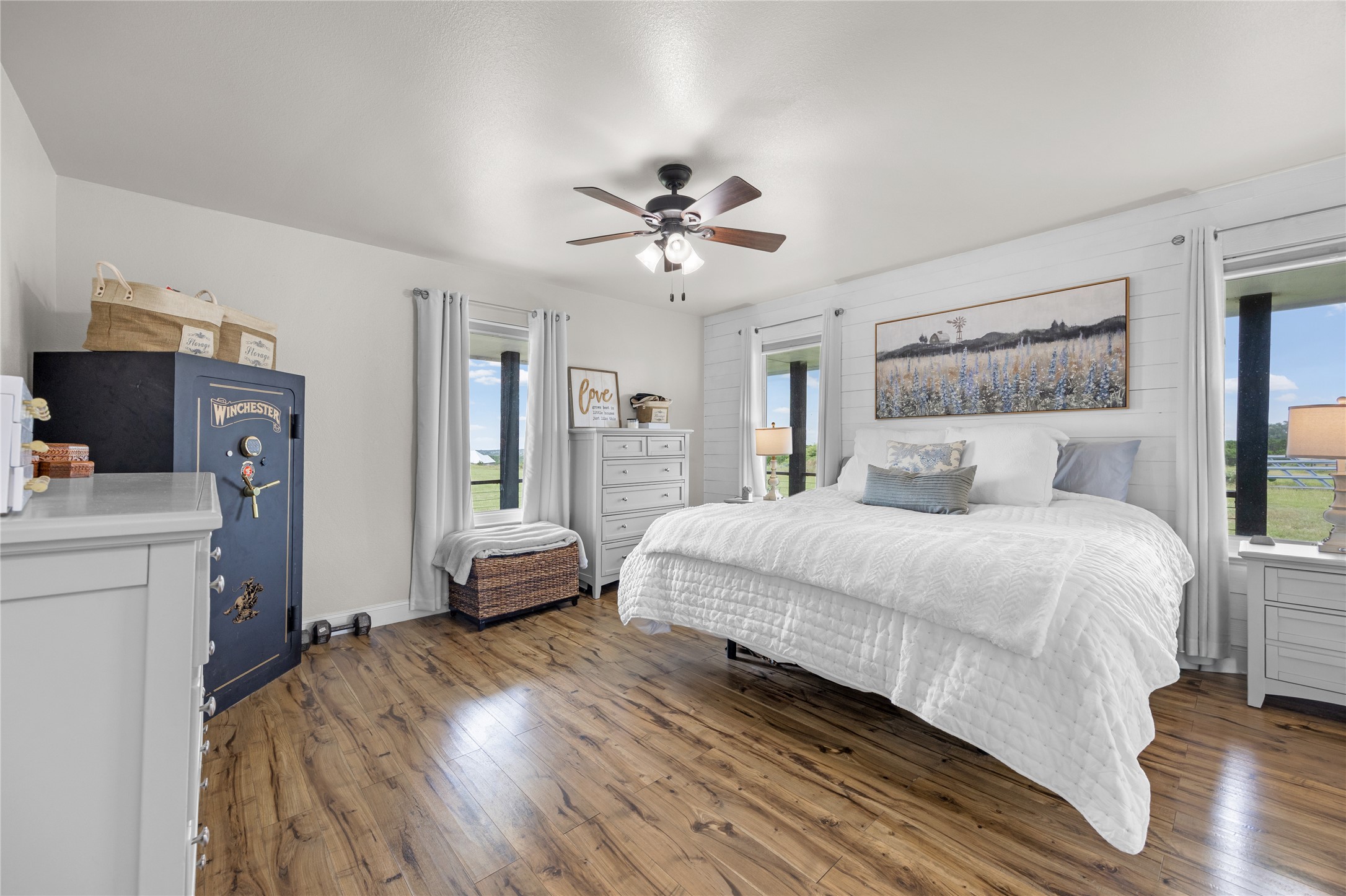 1283 Rattlesnake Trail Burnet, TX 78611 - Photo 22 of 39 a bedroom with a bed and wooden floor
