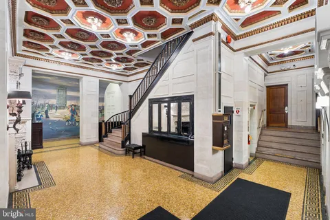 a view of hall way with furniture